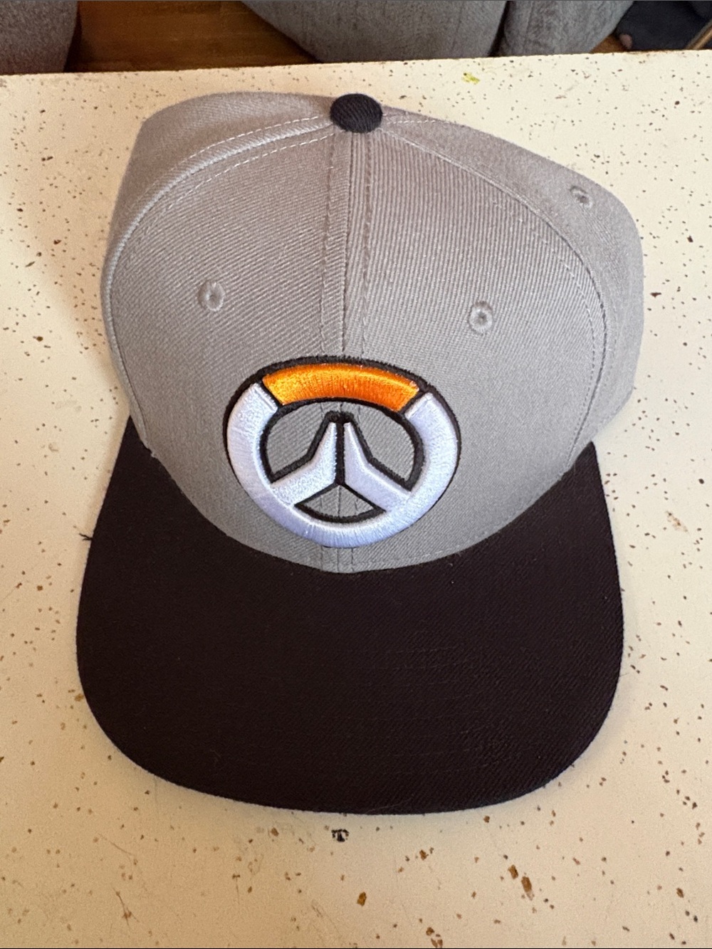 Men’s Overwatch Gray and Black Snapback Hat with Orange Accent